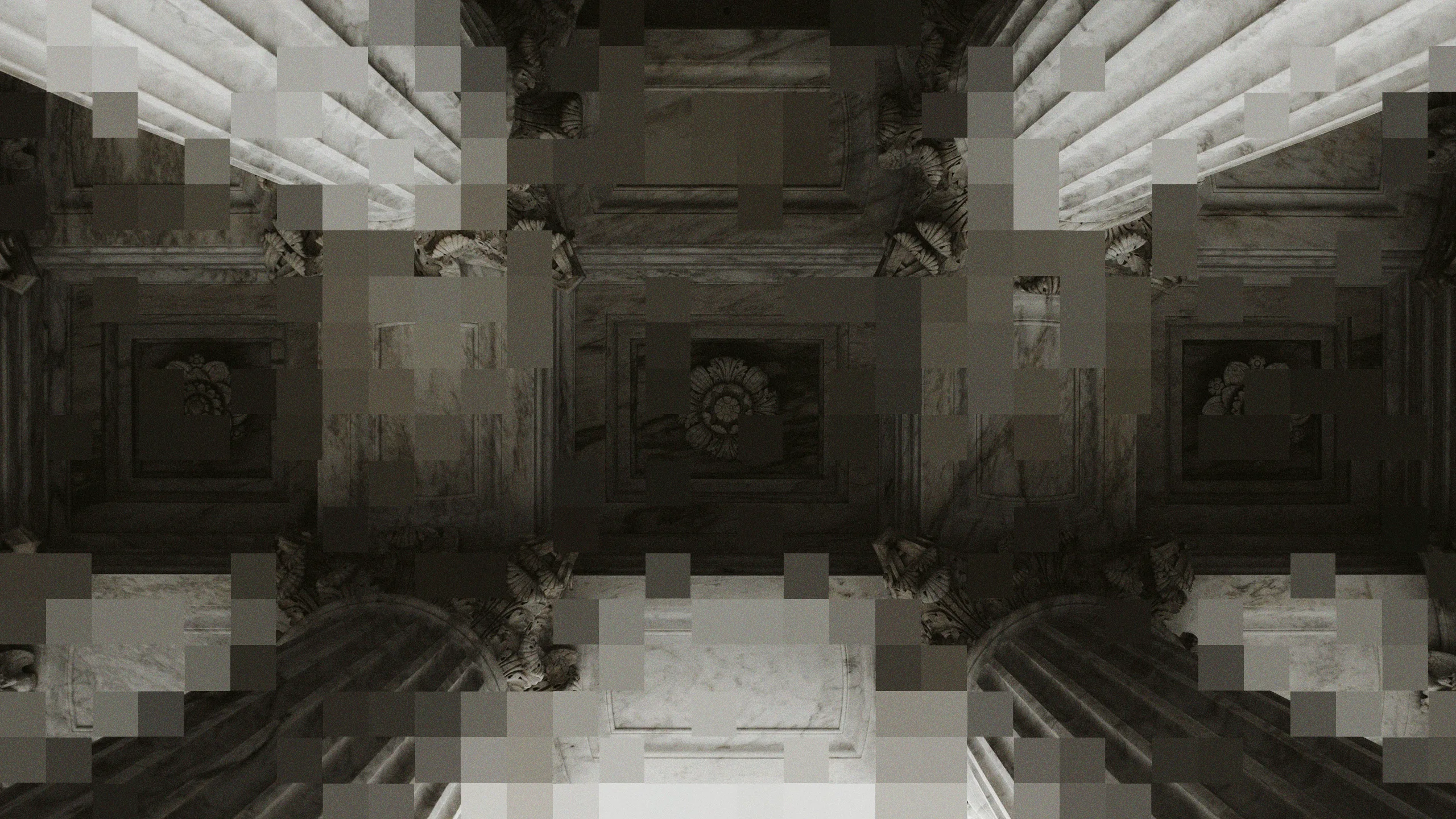 Ornate marble columns and ceiling detail inside a federal building